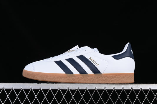 Adidas Gazelle.- blancas y azul marino