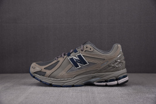 New Balance NB 1906R Gris, azul marino y marrón